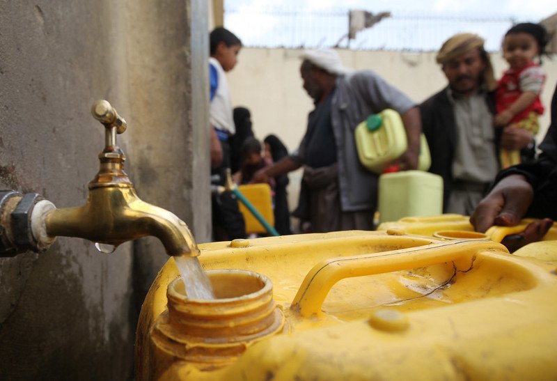 On 8 April, residents fill their containers with water at outdoor taps in Sanaa, the capital, which is experiencing an acute shortage of clean drinking water.  In April 2015 in Yemen, localized conflict among government forces, militants, tribal fighters and other parties since mid-March has spread to many parts of the country. Armed conflict has continued to intensify, and airstrikes, which began on 26 March, have affected 18 of the countrys 22 governorates. The escalating violence has taken a significant toll on civilians. By 12 April, an estimated 364 civilians had been killed and 681 had been injured. At least 77 children had also been killed and 44 had been injured. Infrastructure has also been destroyed, damaged or disrupted as a result of the fighting, including airports and bridges, power and water, sanitation and hygiene (WASH) supply, as well as hospitals, educational and religious institutions, factories, farmlands and local markets. Homes are being directly affected by airstrikes and armed clashes, particularly in the south. The intense fighting has caused large-scale displacement, forcing about 150,000 people to flee their homes. Many of the displaced are believed to be staying primarily with relatives or acquaintances, and others are sheltering in schools. However, many of the most-vulnerable are unable to flee to safety. Insecurity, the closure of ports and other restrictions have significantly exacerbated humanitarian needs and hampered access and the delivery of vital aid to vulnerable communities. Food insecurity is rising, with food prices estimated at 40 per cent  and even higher in some areas. The number of people who are food insecure is now estimated at 12 million a 13 per cent increase since the start of the crisis. Fuel, urgently needed to pump water and to maintain services at hospitals and other critical facilities facing frequent power outages, has run out in many areas and, where it is available, prices have skyrocketed, qu